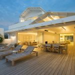 white wooden pool bench near house